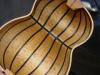 The insde of a quilted maple lutar body