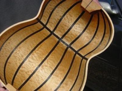 The insde of a quilted maple lutar body